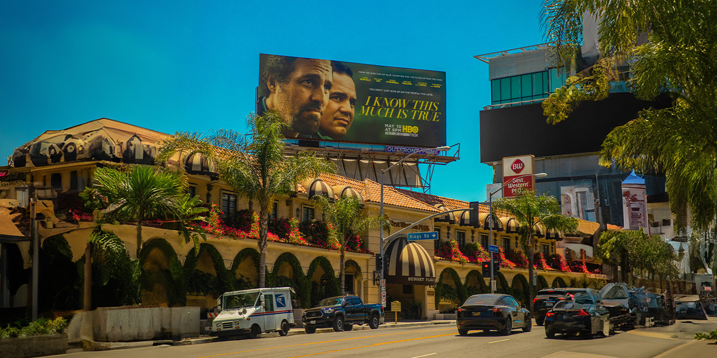 view of mall facade with big digital billboard.