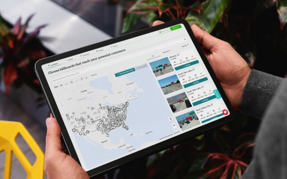 a man holding a tablet showing blip locations